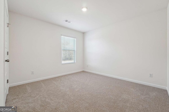 spare room with carpet floors