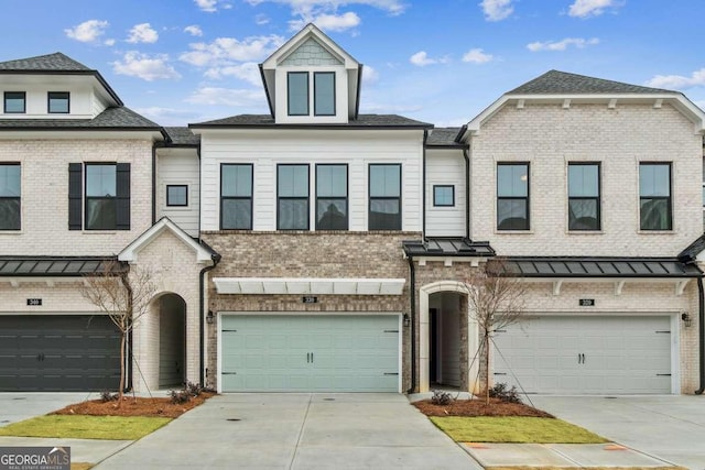 townhome / multi-family property featuring a garage