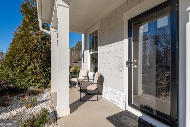 view of exterior entry with covered porch