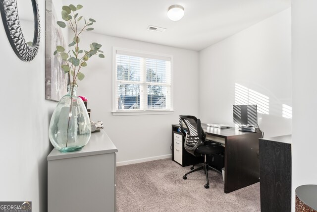 office area featuring light colored carpet