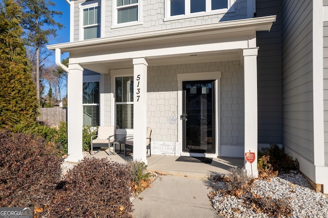 property entrance featuring a porch