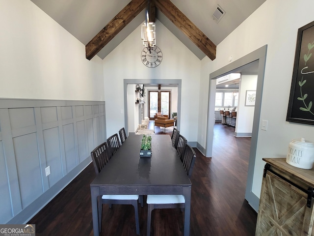 dining area with beamed ceiling, dark hardwood / wood-style floors, and high vaulted ceiling