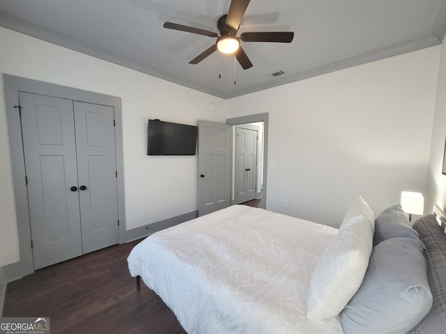 bedroom featuring ceiling fan and dark hardwood / wood-style flooring