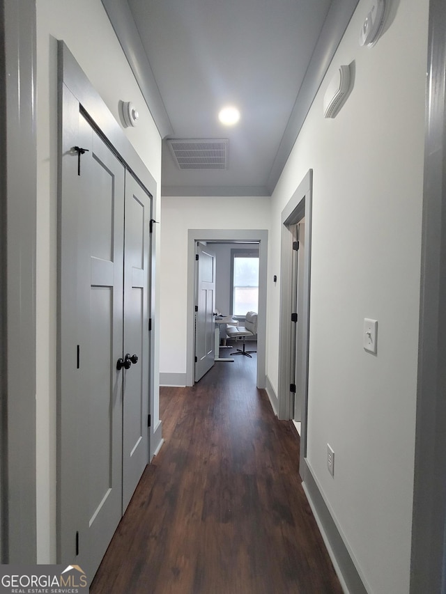 corridor with dark wood-type flooring