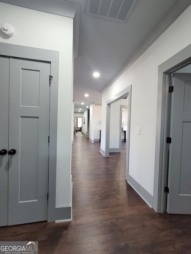 hall featuring dark wood-type flooring