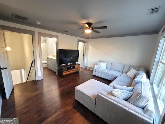 living room featuring ceiling fan, dark hardwood / wood-style flooring, and crown molding