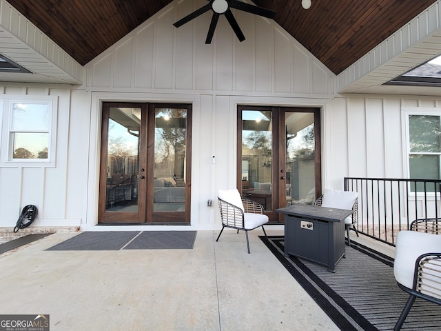 entrance to property with ceiling fan, a patio, and french doors