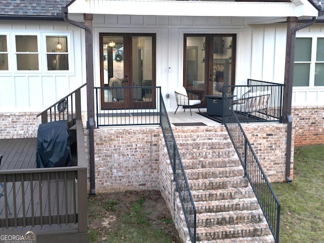 property entrance featuring french doors