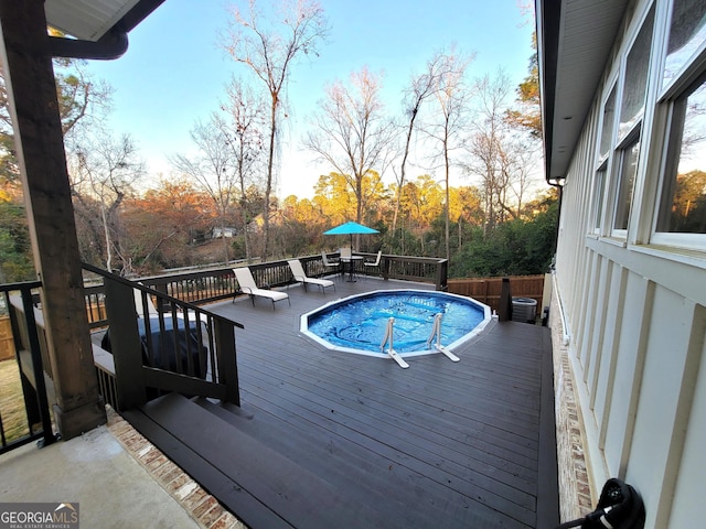 view of pool with a deck