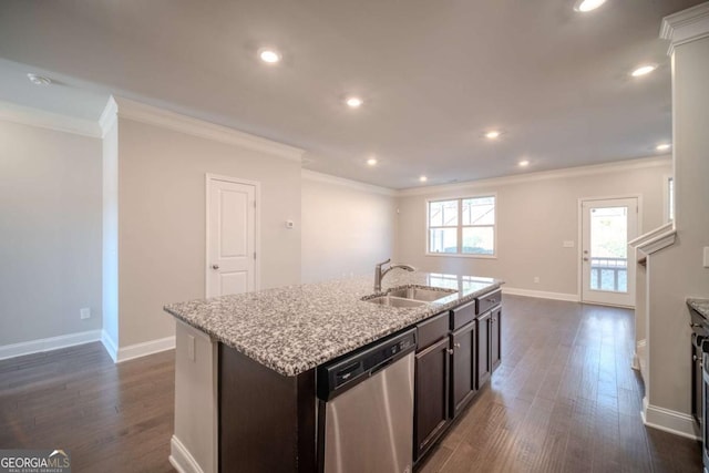 kitchen with stainless steel dishwasher, ornamental molding, dark brown cabinets, sink, and a center island with sink