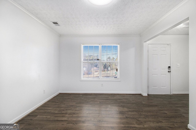 unfurnished room with ornamental molding, dark hardwood / wood-style flooring, and a textured ceiling