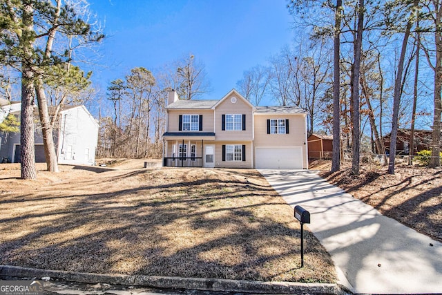 front of property with a porch and a garage