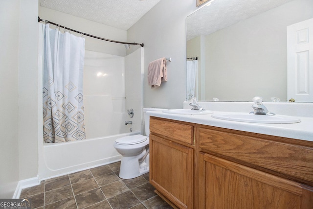 full bathroom featuring vanity, shower / tub combo, a textured ceiling, and toilet