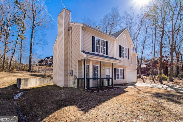 view of front of home with a garage and covered porch