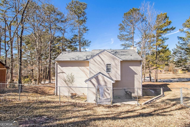 view of side of home featuring a yard