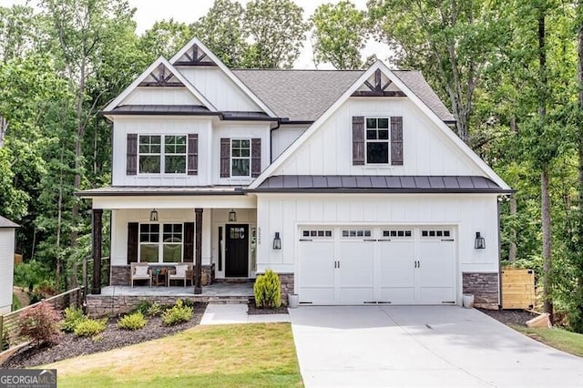 craftsman-style house with a porch, a garage, and a front lawn