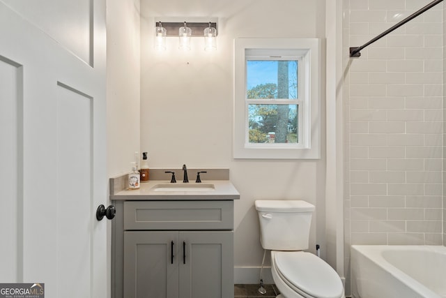 full bathroom with vanity, toilet, and tiled shower / bath combo