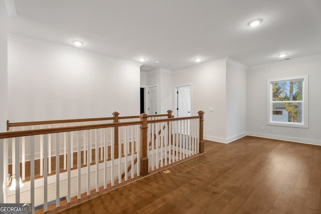 hallway featuring ornamental molding and dark wood-type flooring