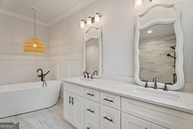 bathroom featuring vanity, a bathtub, and ornamental molding