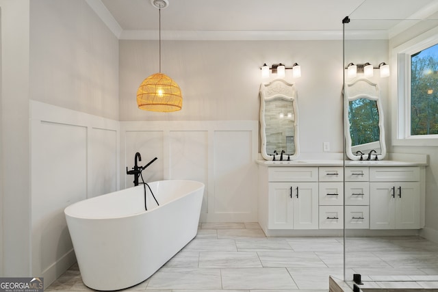 bathroom featuring a washtub and vanity