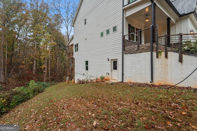 view of home's exterior with a lawn