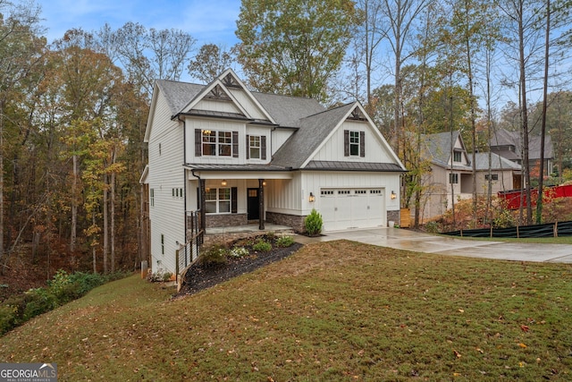 view of front facade featuring a garage, covered porch, and a front lawn