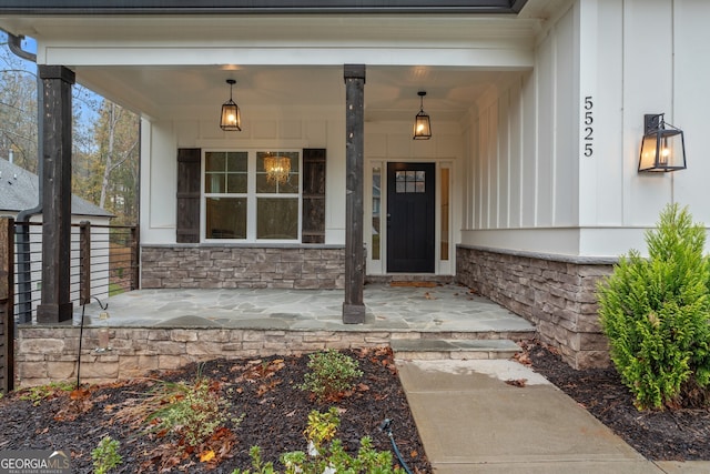 entrance to property featuring covered porch