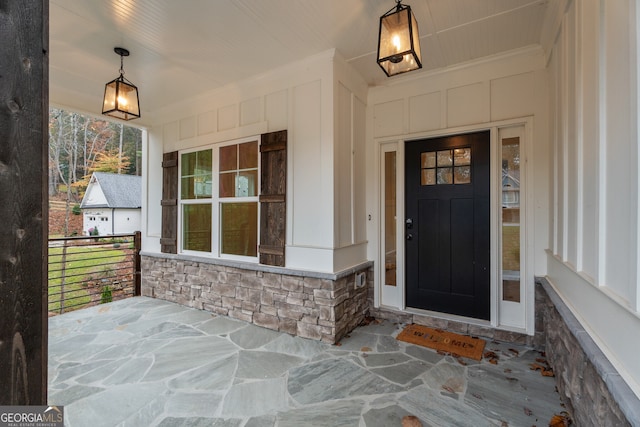 property entrance featuring covered porch