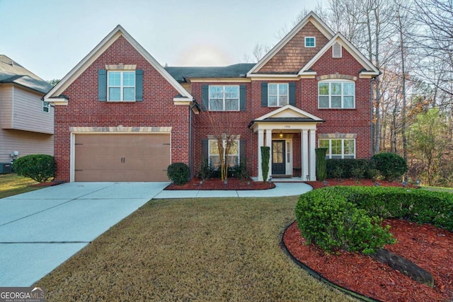 view of front of house with a front yard, a garage, and cooling unit