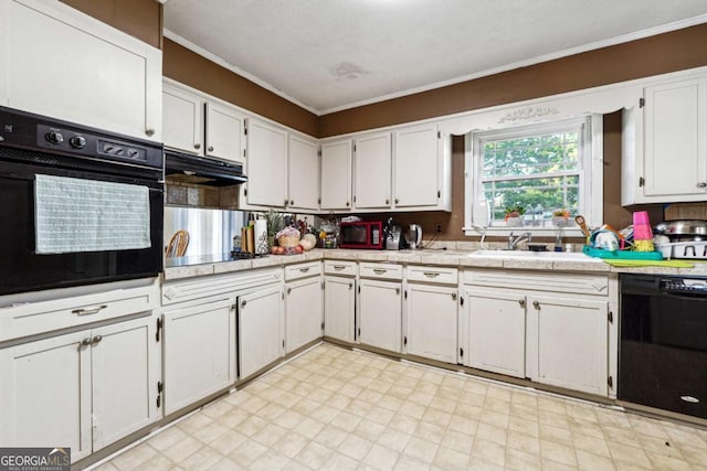 kitchen featuring white cabinets, sink, crown molding, and black appliances