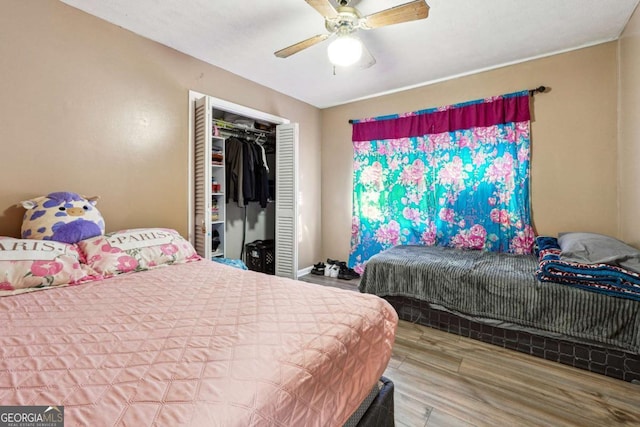 bedroom with a closet, ceiling fan, and hardwood / wood-style flooring