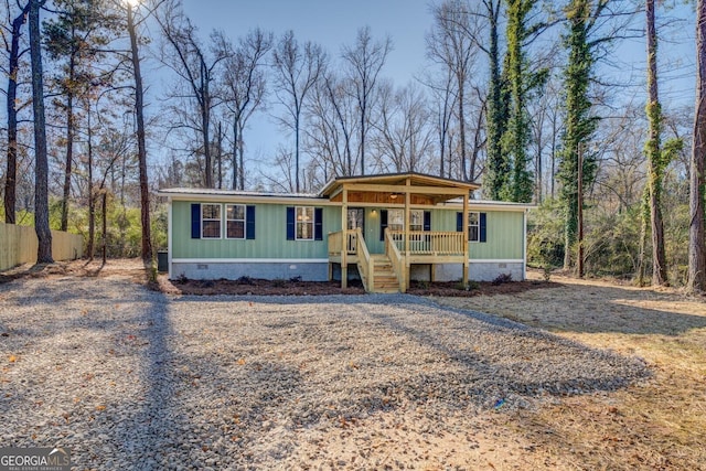 manufactured / mobile home featuring covered porch