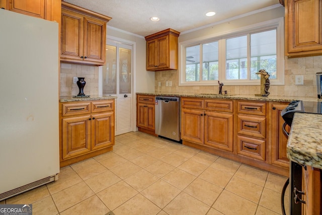 kitchen with white refrigerator, sink, stainless steel dishwasher, light tile patterned flooring, and light stone counters