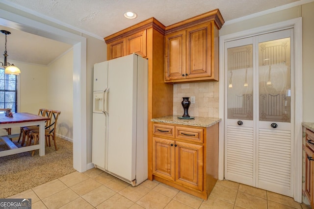 kitchen with white refrigerator with ice dispenser, backsplash, crown molding, light colored carpet, and pendant lighting