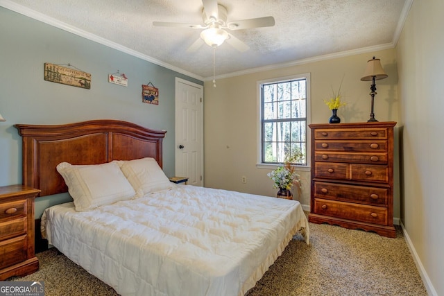 bedroom with carpet flooring, a textured ceiling, ceiling fan, and ornamental molding