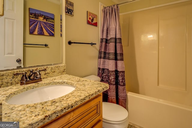 full bathroom with vanity, shower / tub combo, and toilet