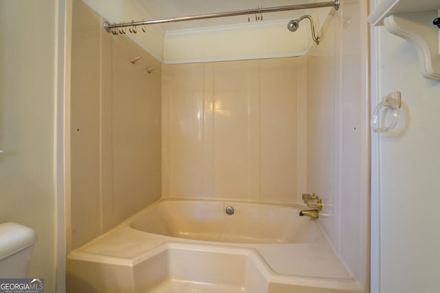 bathroom featuring bathing tub / shower combination and toilet