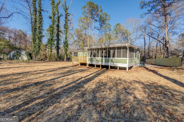 view of front of home with a sunroom