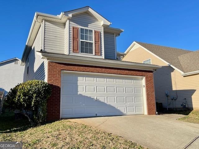 view of side of property with a garage