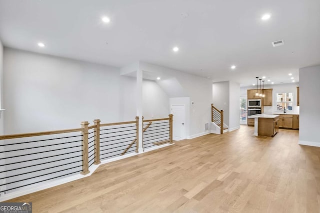 living room with light hardwood / wood-style flooring