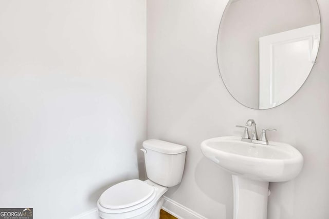 bathroom with toilet and sink