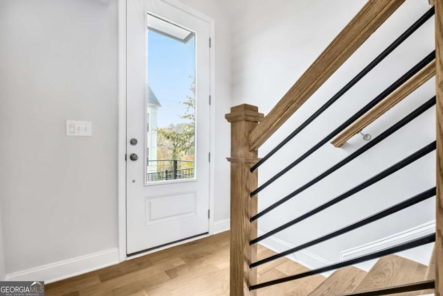 doorway with light wood-type flooring