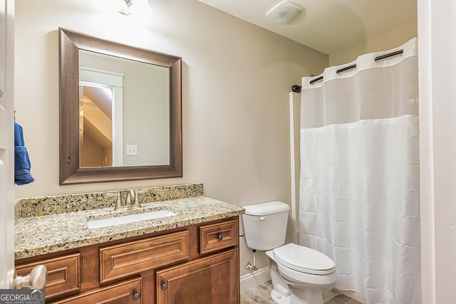 bathroom with walk in shower, vanity, and toilet