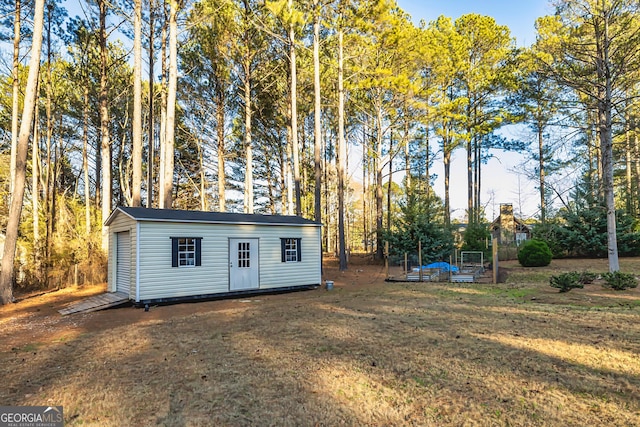 view of outdoor structure with a yard