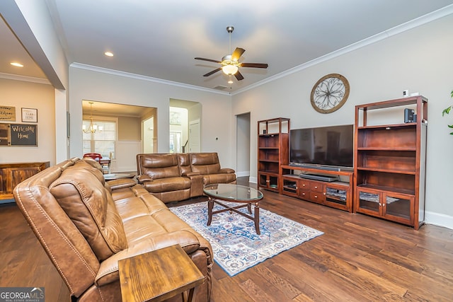 living room with ceiling fan with notable chandelier, dark hardwood / wood-style floors, and ornamental molding