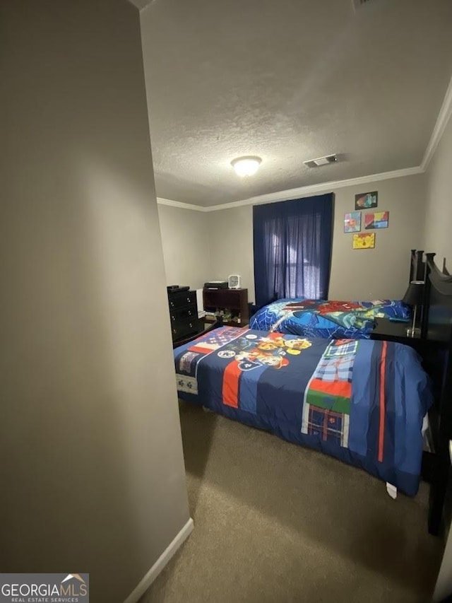 carpeted bedroom with a textured ceiling and ornamental molding