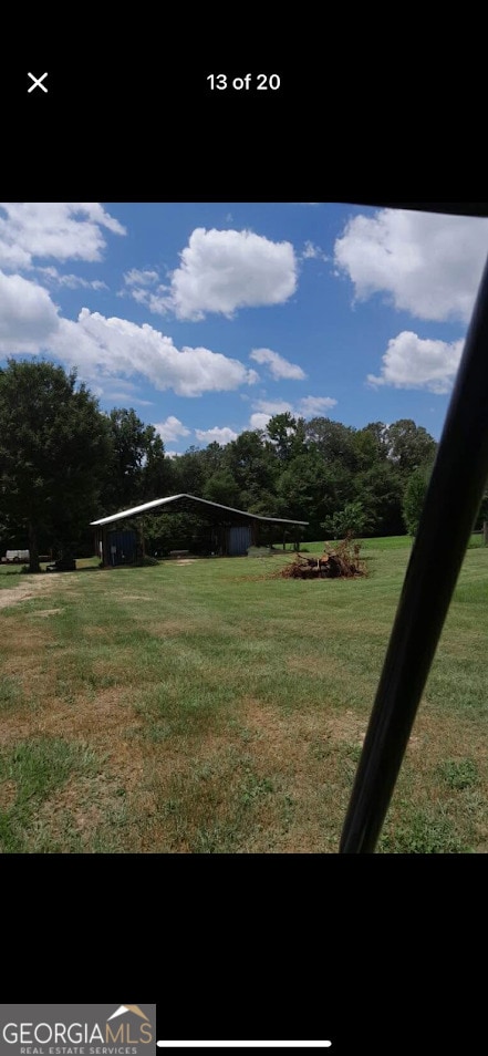 view of property's community with a yard