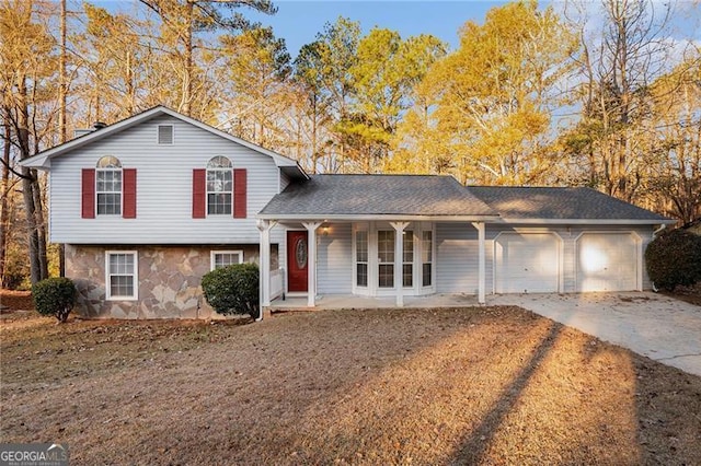 view of front of property with covered porch and a garage