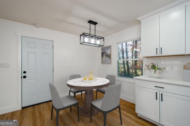 dining area featuring wood-type flooring