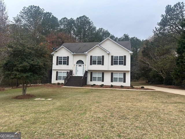 bi-level home with a front yard